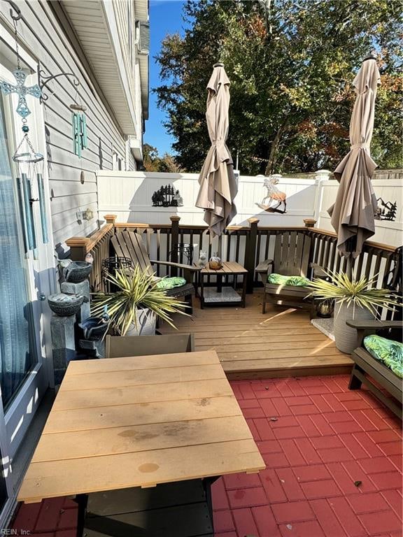 wooden terrace featuring an outdoor hangout area