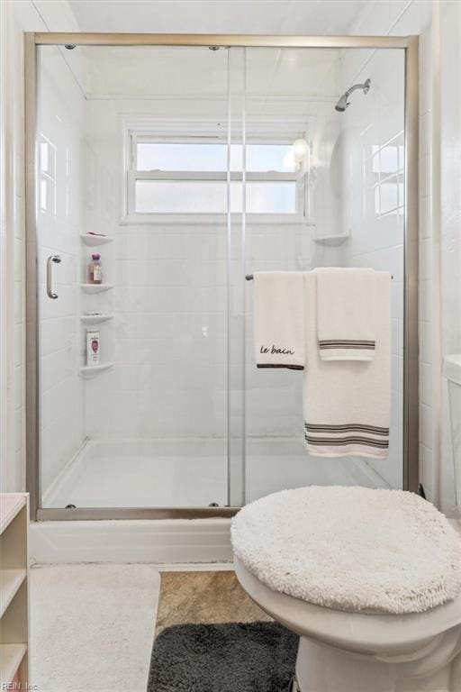 bathroom with tile patterned floors, vanity, and an enclosed shower