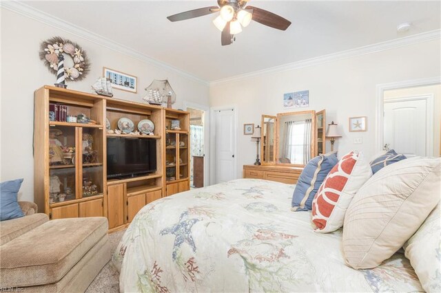 bedroom with ceiling fan and crown molding