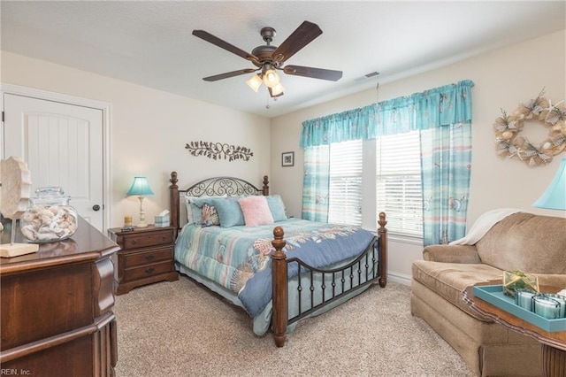 bedroom with light carpet and ceiling fan