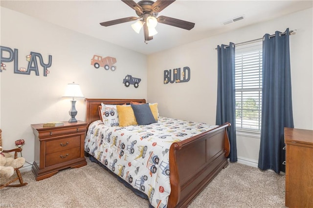 bedroom featuring ceiling fan and light carpet