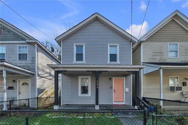 front facade with cooling unit and a porch