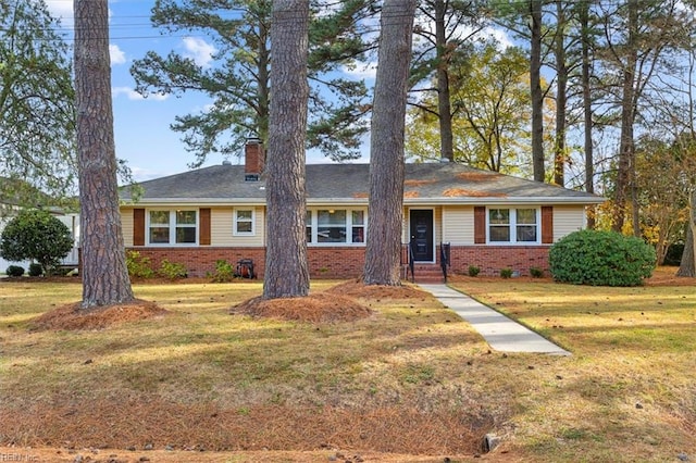 ranch-style house featuring a front lawn