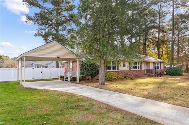 single story home with a front yard and a carport