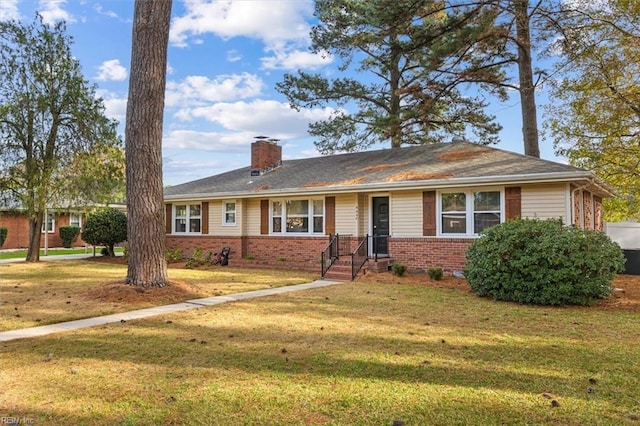 single story home featuring a front lawn