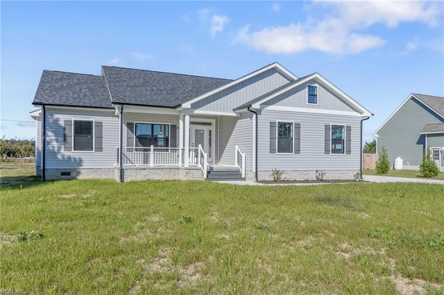 view of front of home with covered porch and a front lawn