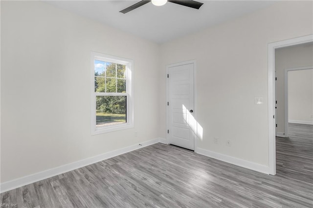 spare room with ceiling fan and light hardwood / wood-style floors