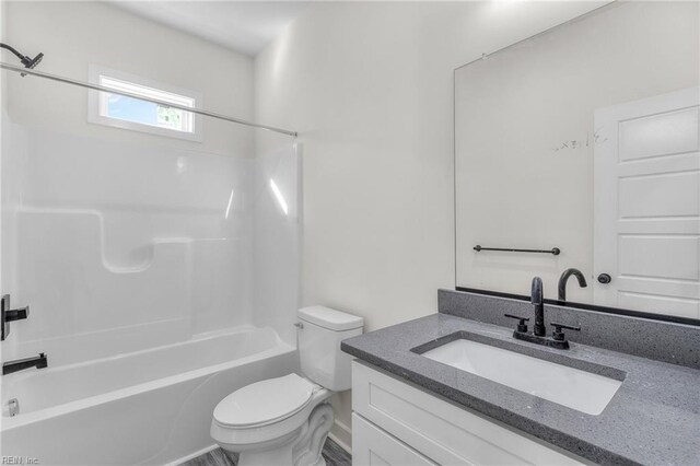 full bathroom featuring vanity, toilet, and shower / bath combination