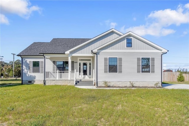 view of front of home featuring covered porch and a front lawn