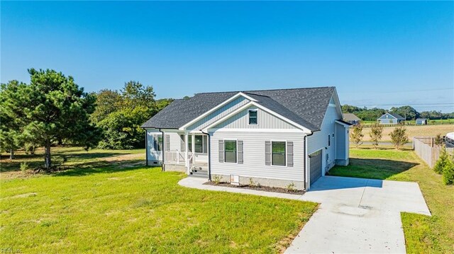 bungalow-style house featuring a garage and a front lawn