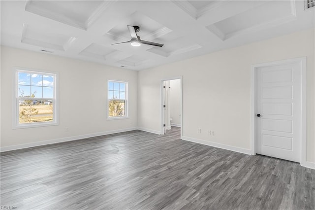 spare room featuring beamed ceiling, wood-type flooring, and coffered ceiling