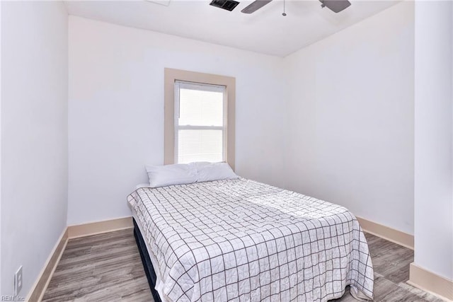 bedroom featuring hardwood / wood-style flooring and ceiling fan