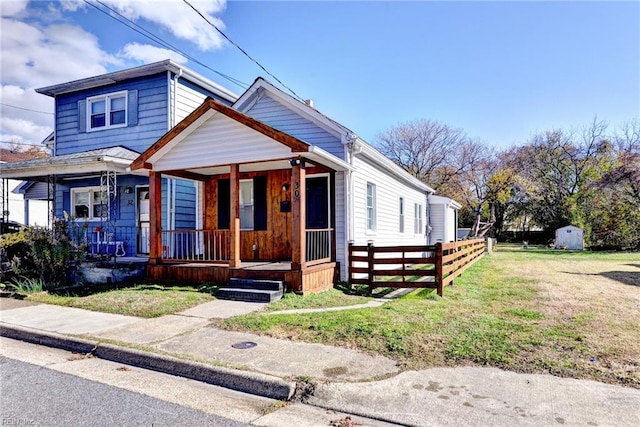 view of front of property with a porch and a front yard