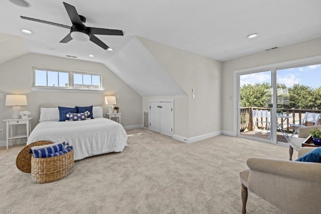 bedroom featuring multiple windows, access to exterior, light colored carpet, and ceiling fan