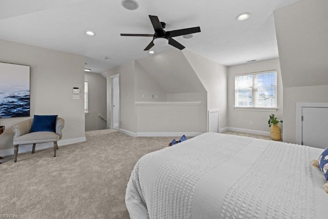 carpeted bedroom with ceiling fan and vaulted ceiling