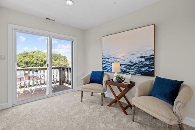 sitting room with light carpet