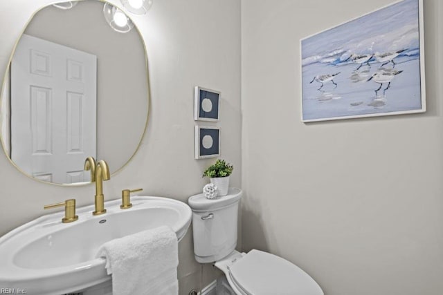 bathroom featuring sink and toilet