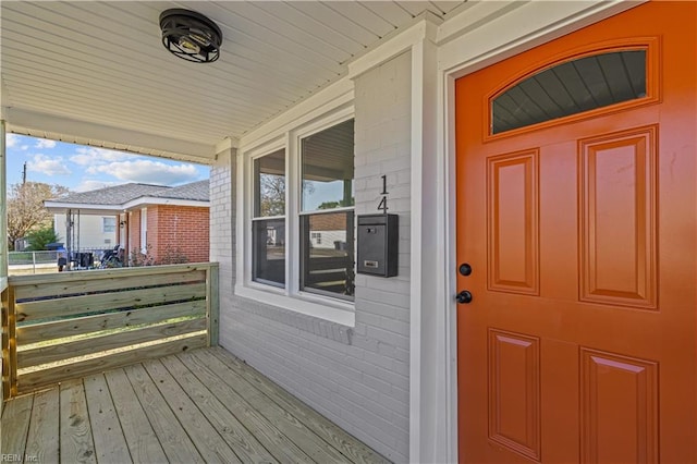 entrance to property featuring covered porch