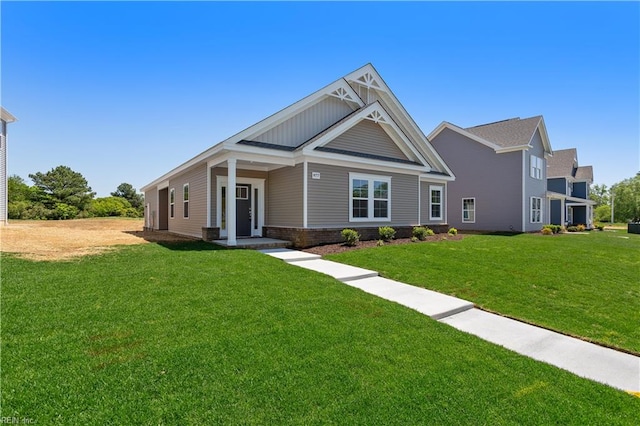 craftsman-style home with a front yard