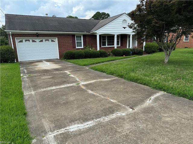 view of front of house featuring a front yard and a garage