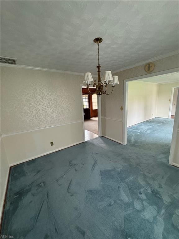 unfurnished dining area with carpet, ornamental molding, and an inviting chandelier