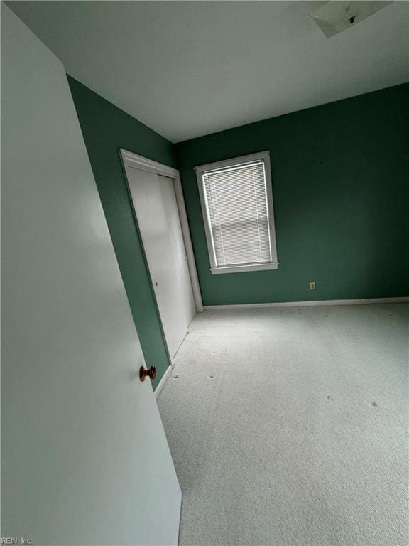 spare room with light carpet