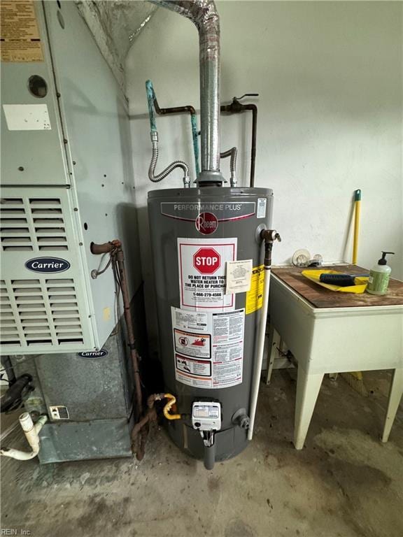 utility room featuring sink and water heater