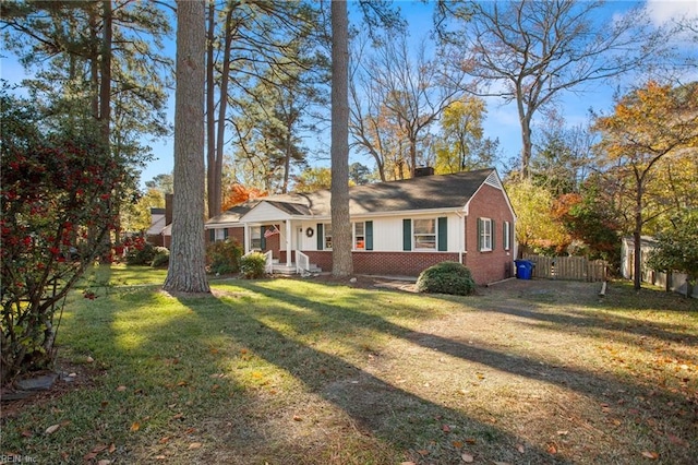 single story home with a front lawn