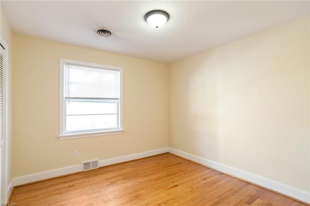 spare room featuring light hardwood / wood-style floors