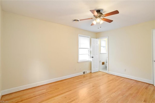 spare room featuring ceiling fan and light wood-type flooring