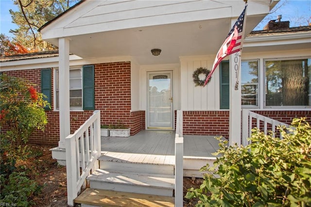 entrance to property featuring a porch