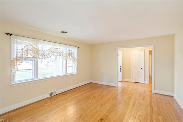 unfurnished room featuring light wood-type flooring