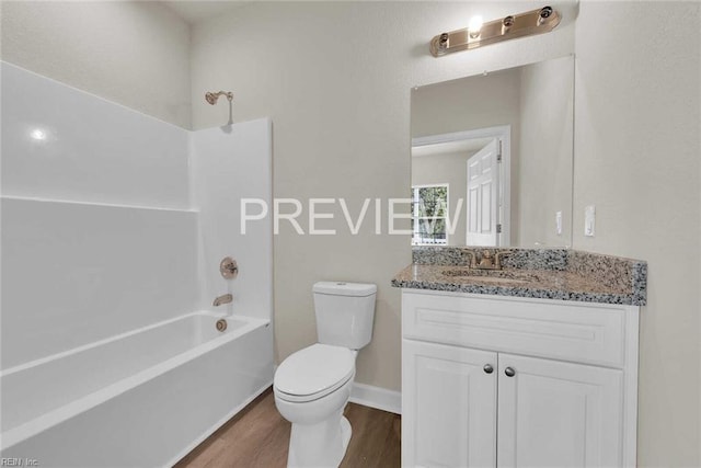 full bathroom featuring vanity, wood-type flooring, shower / bathtub combination, and toilet