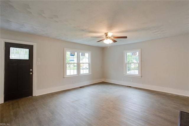 entryway with dark hardwood / wood-style floors and ceiling fan