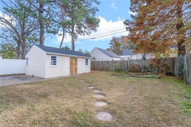 view of yard featuring a patio area and an outbuilding