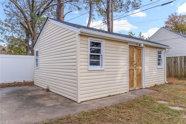 view of outbuilding with a lawn