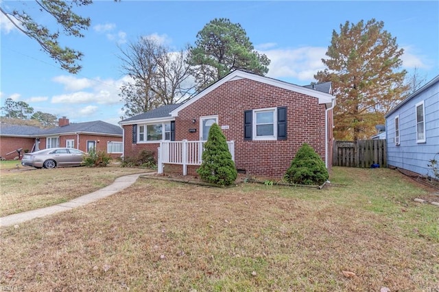 bungalow-style house featuring a front lawn