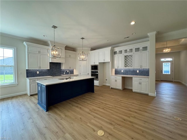 kitchen featuring white cabinets, stainless steel appliances, and a healthy amount of sunlight