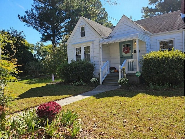 bungalow with a front lawn and a porch