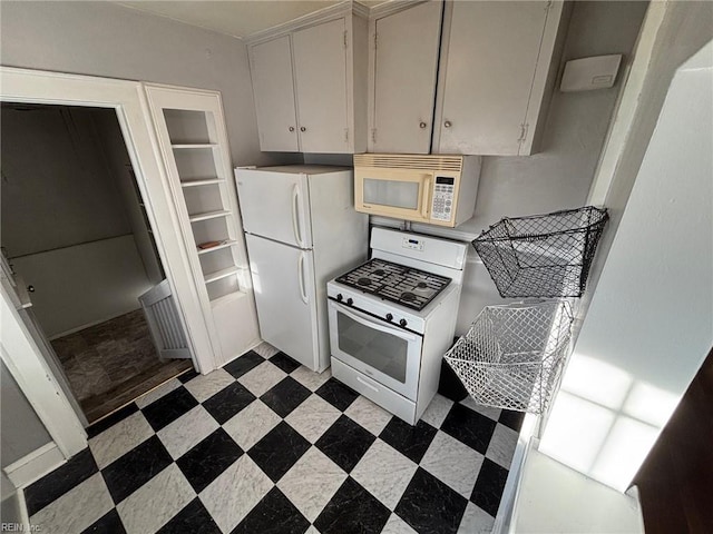 kitchen with white cabinets and white appliances