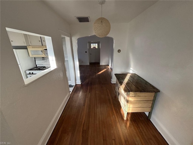 hall with dark wood-type flooring