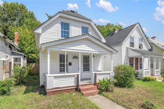 view of front of home with a front lawn and covered porch