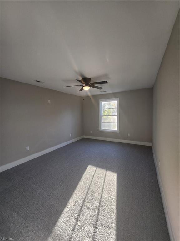 empty room with carpet flooring and ceiling fan