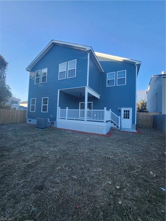 rear view of property with central air condition unit and a wooden deck