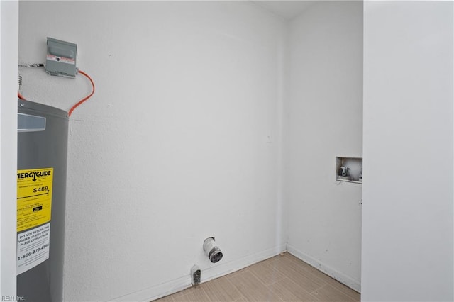 laundry area with hookup for a washing machine and light hardwood / wood-style floors