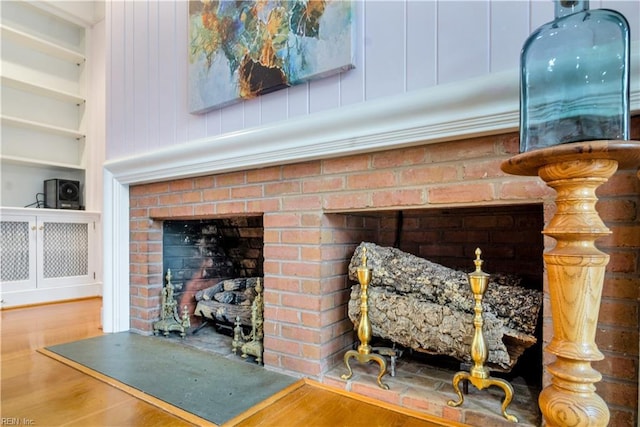 room details with built in shelves and wood-type flooring