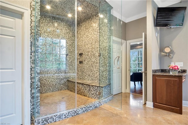 bathroom featuring tile patterned floors, an enclosed shower, and crown molding