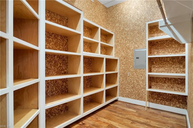 mudroom with hardwood / wood-style floors and electric panel