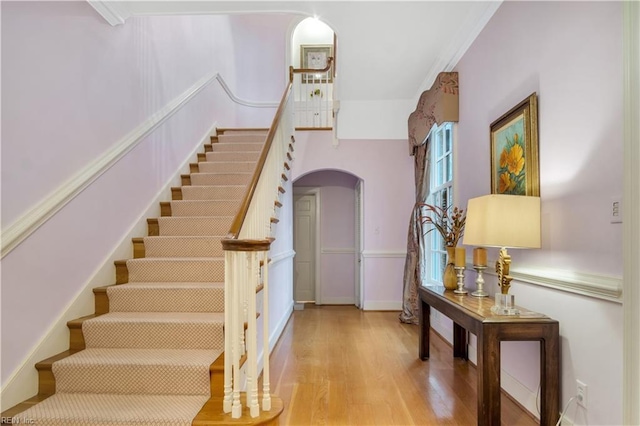 stairway with hardwood / wood-style flooring