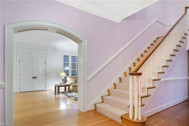 foyer featuring hardwood / wood-style floors and ornamental molding